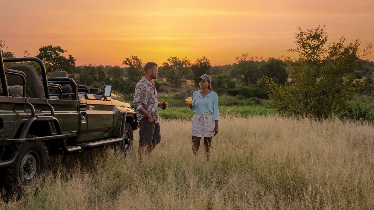 Couple on safari drinking in South Africa
